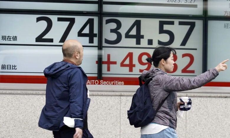 Asian shares uneasy, while futures for US and Europe show slight gains